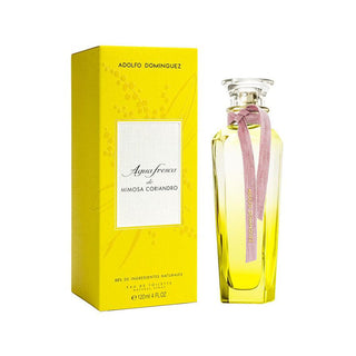 Frasco de perfume ‘Agua Fresca Mimosa Coriandro’ da ADOLFO DOMINGUEZ, com líquido amarelo e fita rosa, ao lado da sua caixa de embalagem amarela com padrões florais.